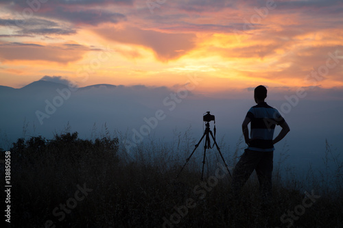 Photographer Awaits the Sunrise