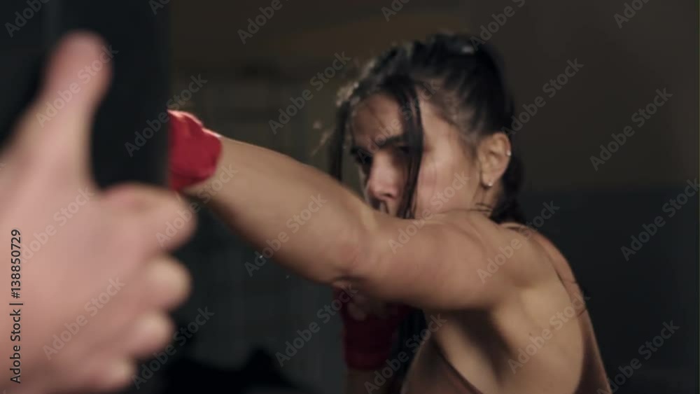 Young woman doing punches Young woman doing punches