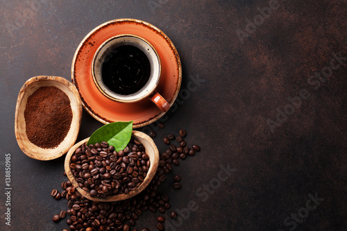 Coffee cup, beans and ground powder