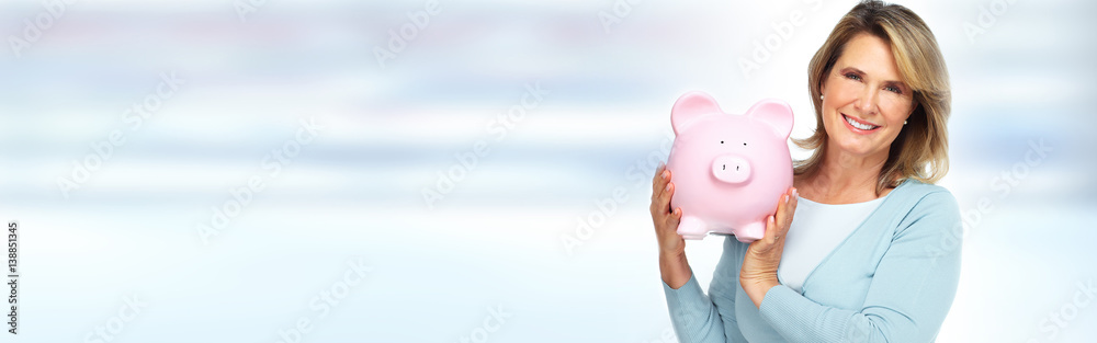 Mature woman with piggy bank. Mature woman with piggy bank.