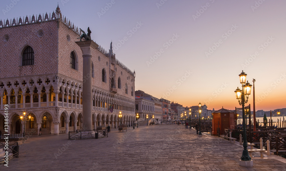 VENICE, ITALY - MARCH 12, 2014: Doge palace and and waterfront in morning dusk.