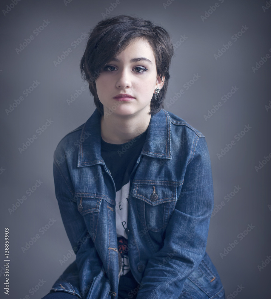 Teenage girl with short hair and makeup Stock Photo | Adobe Stock