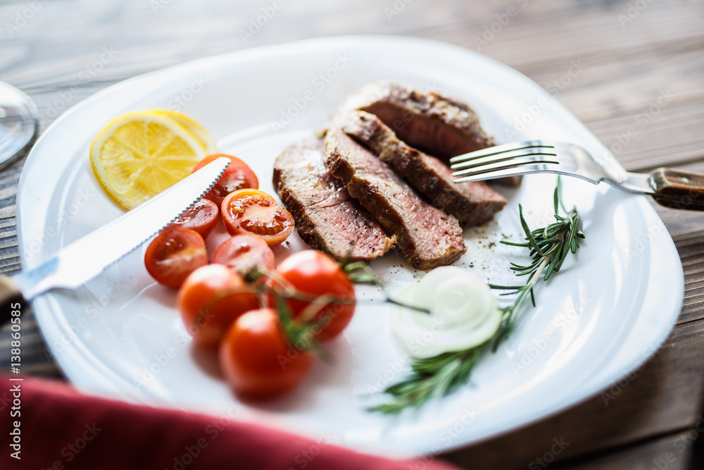 Beef steak with red wine of a rich dining table Beef steak with red wine of a rich dining table