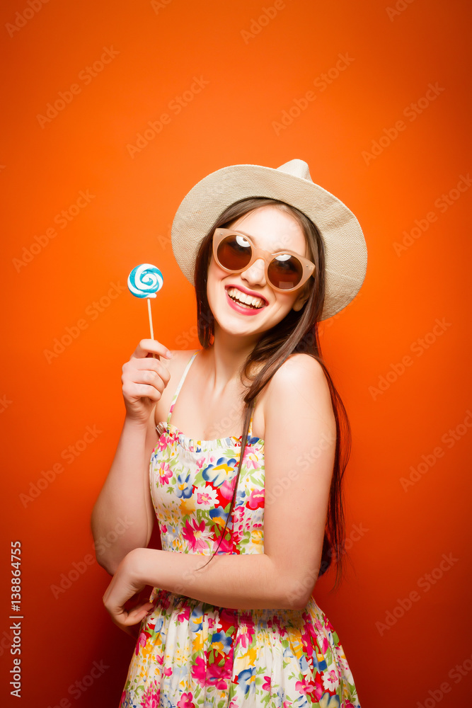 Beautiful smiling woman. Over orange background Beautiful smiling woman. Over orange background