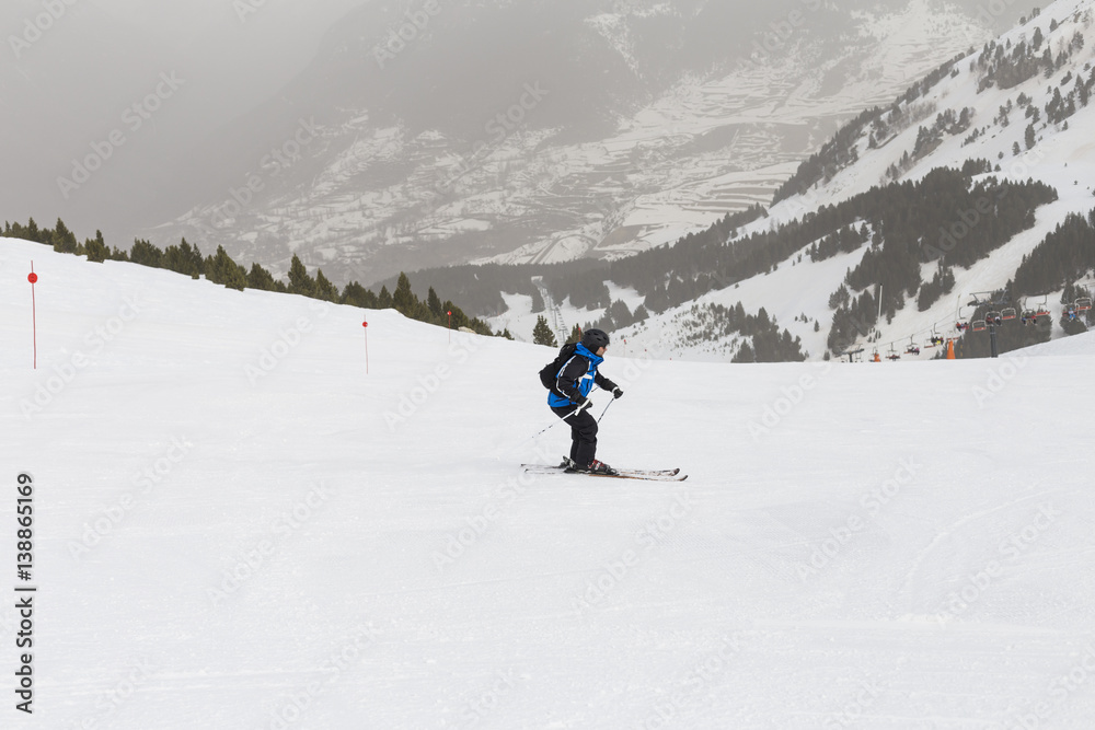 skier skiing on fresh powder snow. winter season. Sports skier skiing on fresh powder snow. winter season. Sports