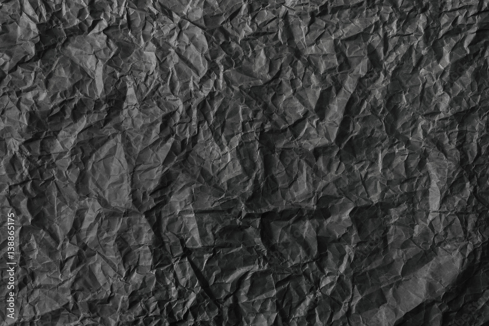 texture of crumpled black paper.
