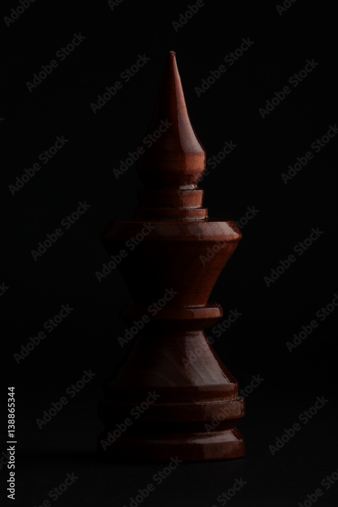 Chess. Black Bishop on black background. Сhess figure. Template, place for text. Chess. Black Bishop on black background. Сhess figure. Template, place for text.