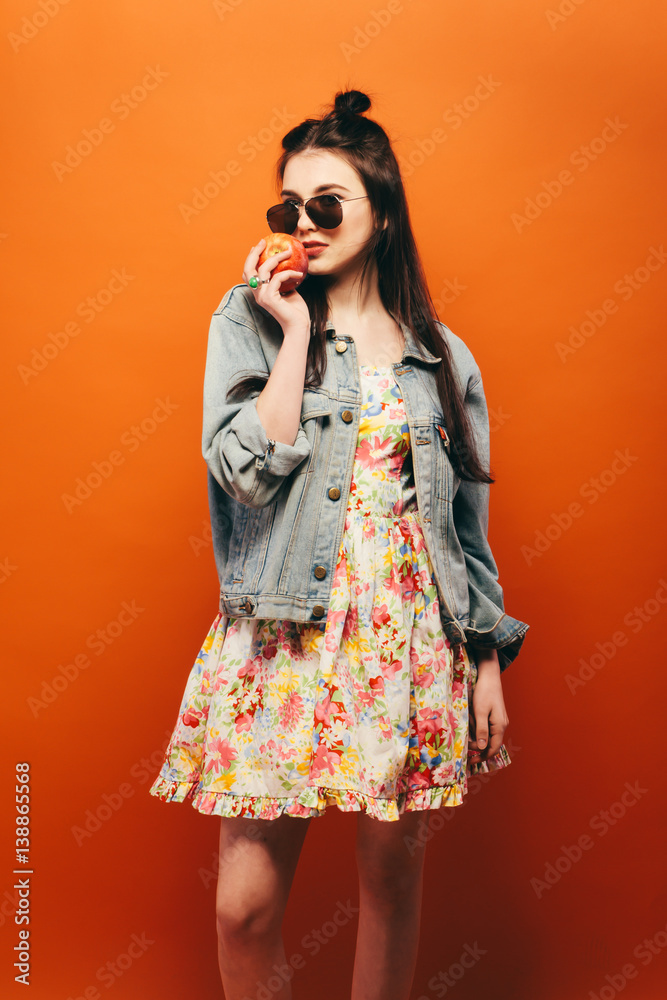 Beautiful teen girl. Hippy. orange background