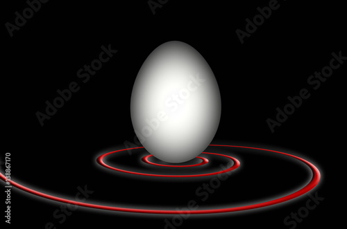 Huevo y espiral roja sobre fondo negro