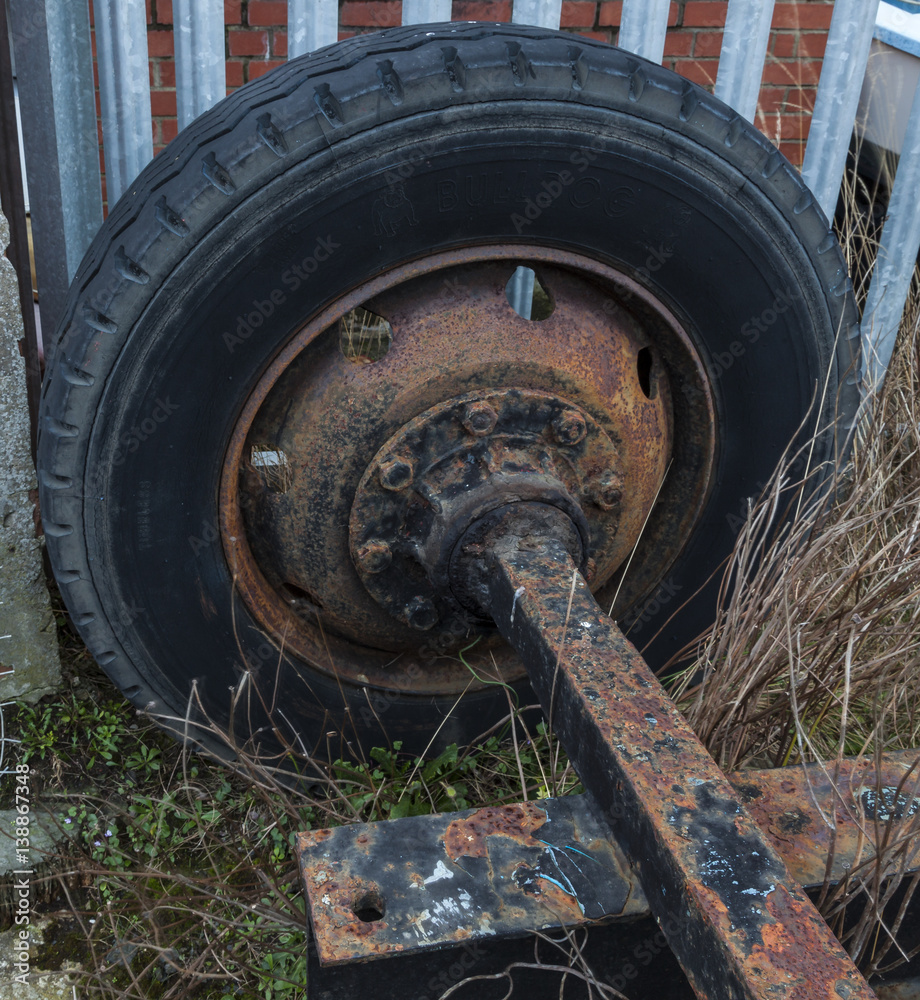 Old, rusty, Trailer wheel and axle.