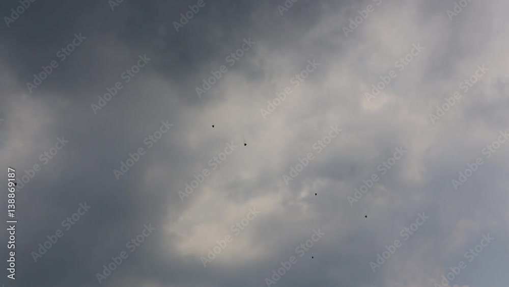 Chinese lanterns flying in the cloudy sky. It is believed that with the release of flyers lanterns brings good luck and prosperity. Chinese lanterns flying in the cloudy sky. It is believed that with the release of flyers lanterns brings good luck and prosperity.