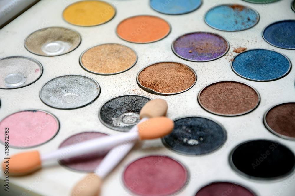 Close up view of eyes shadow color palette with two brushes. Close up view of eyes shadow color palette with two brushes.