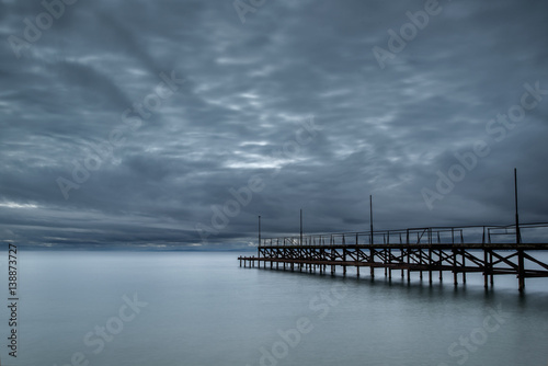 Wallpaper Mural Dramatic cloudy sky with sea bridge in Ravda, Bulgaria. Slow motion effect. Torontodigital.ca