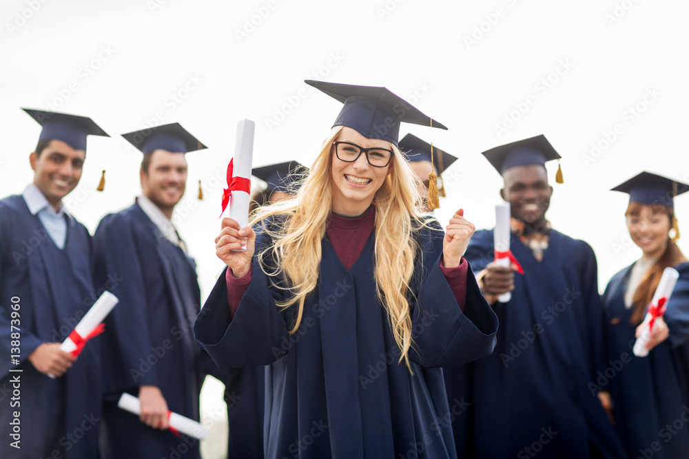 happy student with diploma celebrating graduation happy student with diploma celebrating graduation