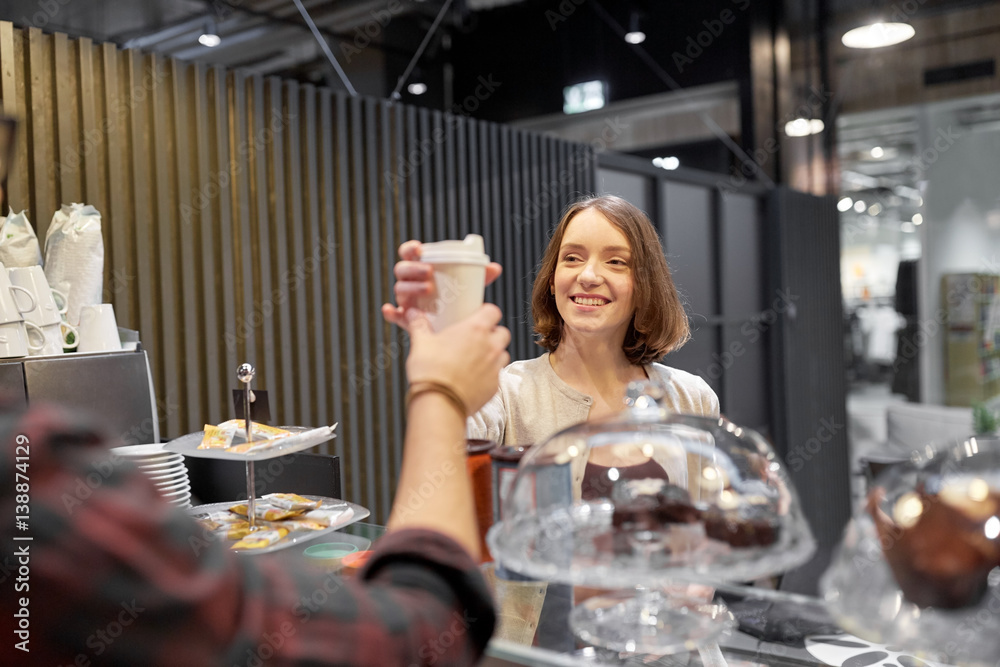 happy woman taking coffee cup from seller at cafe happy woman taking coffee cup from seller at cafe