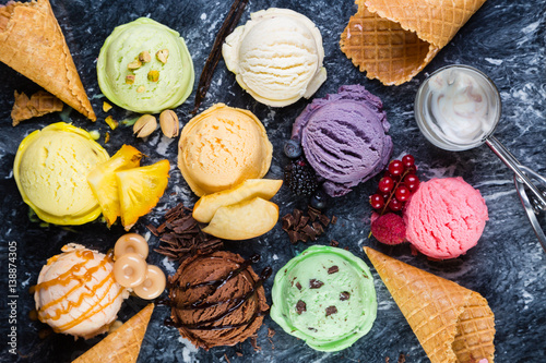 Selection of colorful ice cream scoops on marble background