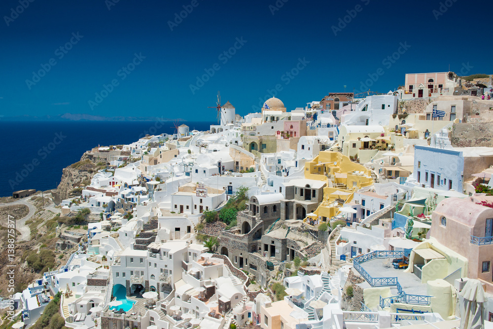 Architecture of  island of Santorini, the most romantic island in the world, Greece. Hotels in Santorini. Walking the streets of Fira summer day, Travel to Greece. Beautiful white exterior Santorini
