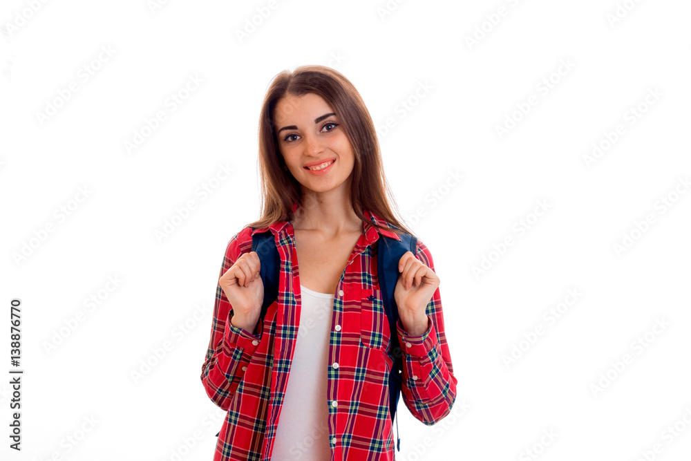 cute young girl in shirt smiling and holding a Briefcase on the shoulders cute young girl in shirt smiling and holding a Briefcase on the shoulders