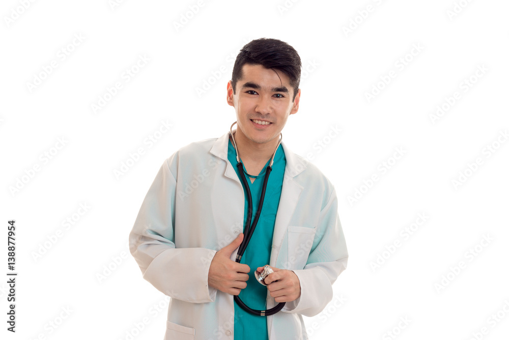 young attractive doctor in blue uniform with stethoscope on his neck isolated on white background young attractive doctor in blue uniform with stethoscope on his neck isolated on white background