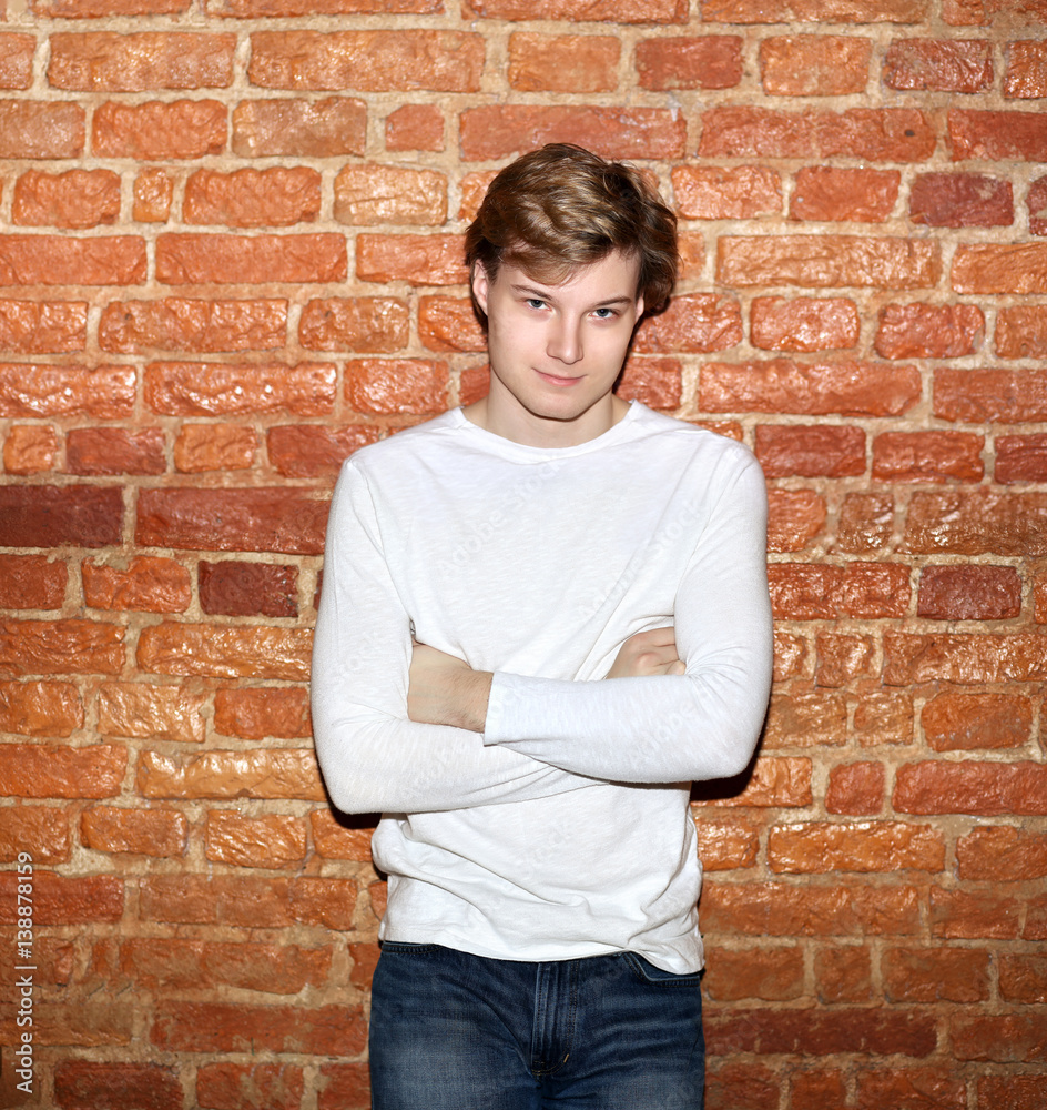Attractive teenage boy in urban background Attractive teenage boy in urban background
