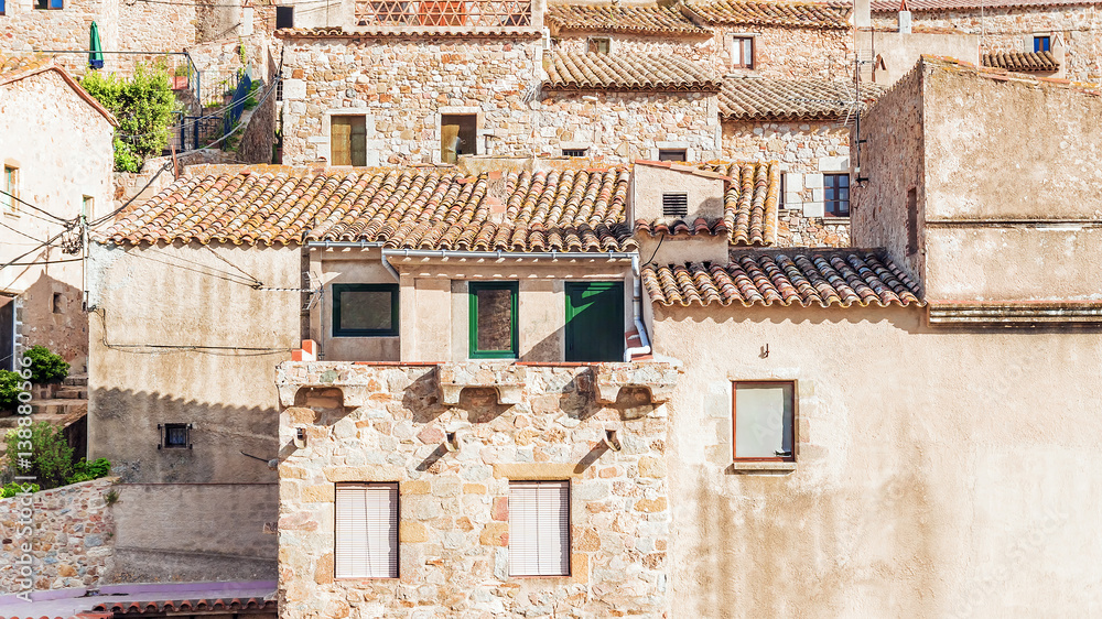 facades of old houses in Tossa de Mar, Spain