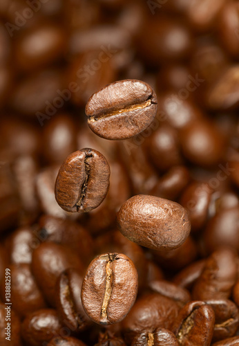 Macro photo of flying coffee beans. All beans in focus.