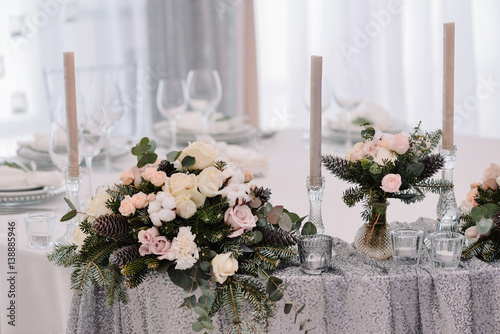 Beautiful tenderless bouquet on wedding table photo