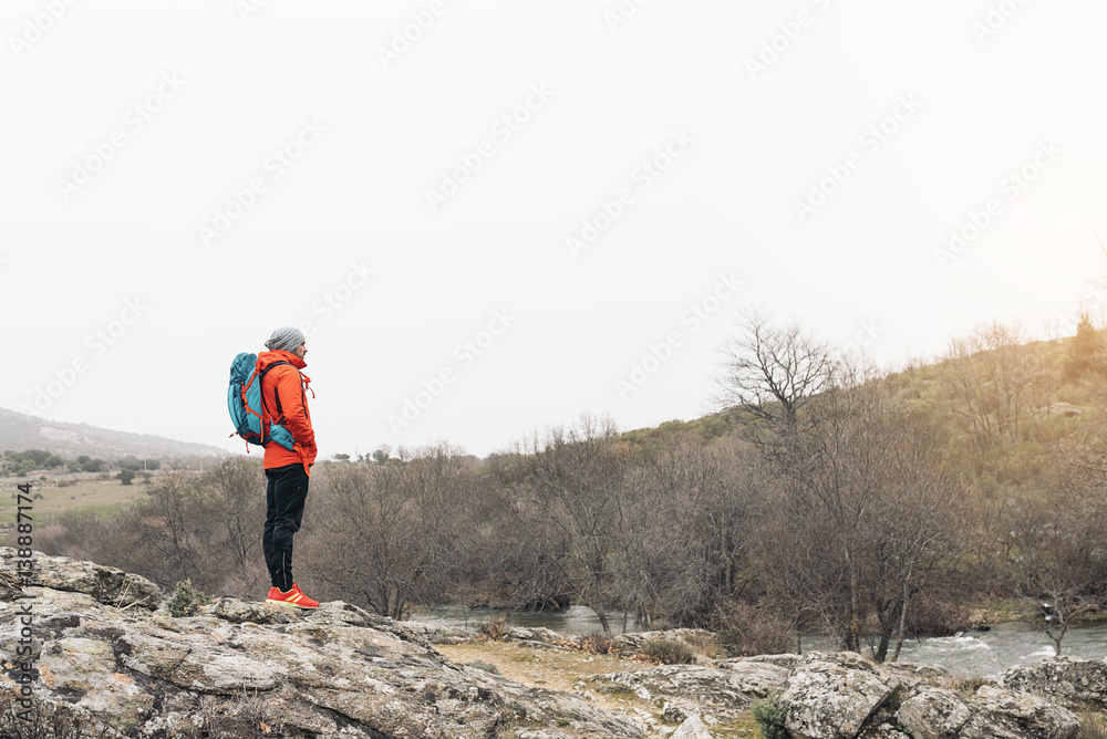 Fototapeta premium Young Backpacker enjoying of Nature.
