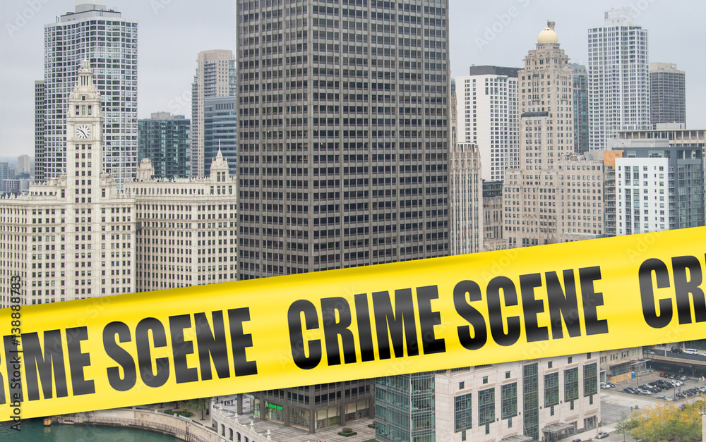 Fototapeta premium Crime scene cordon tape superimposed over Chicago skyline