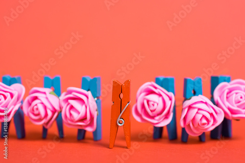colorful wooden clothespin - abstract vision of men with bouquet of pink roses and woman. Happy Women's Day greeting