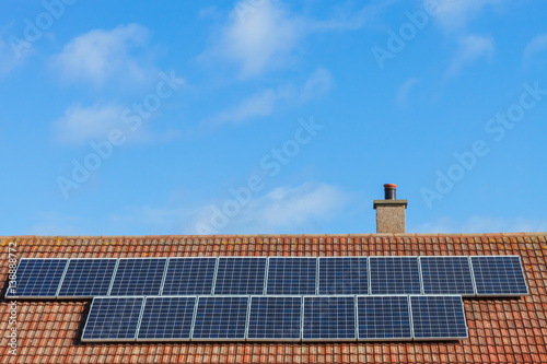 Solar panels on a rooftop, Buckie, Moray, Scotland, UK photo