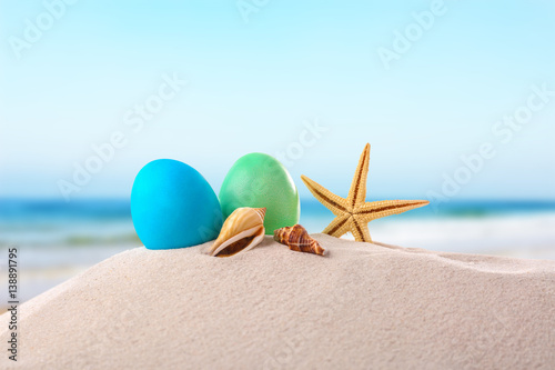 Easter eggs with sand, on white background