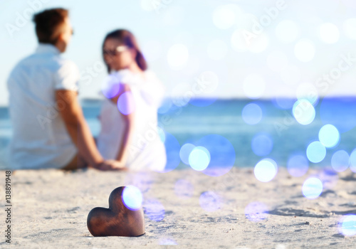 Decorative heart on sand an...