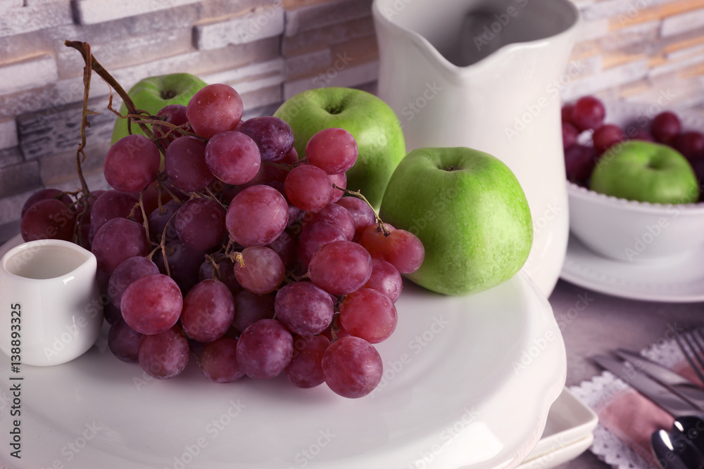 Composition with fresh fruits on white stand, close up