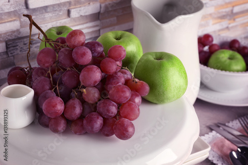 Composition with fresh fruits on white stand  close up