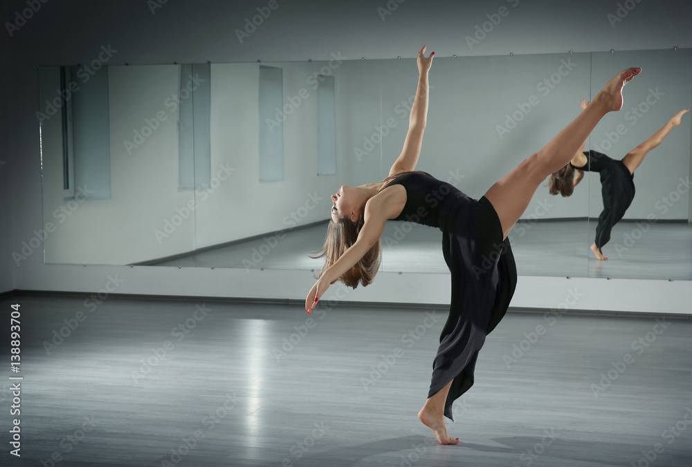 Beautiful young woman dancing in studio Beautiful young woman dancing in studio