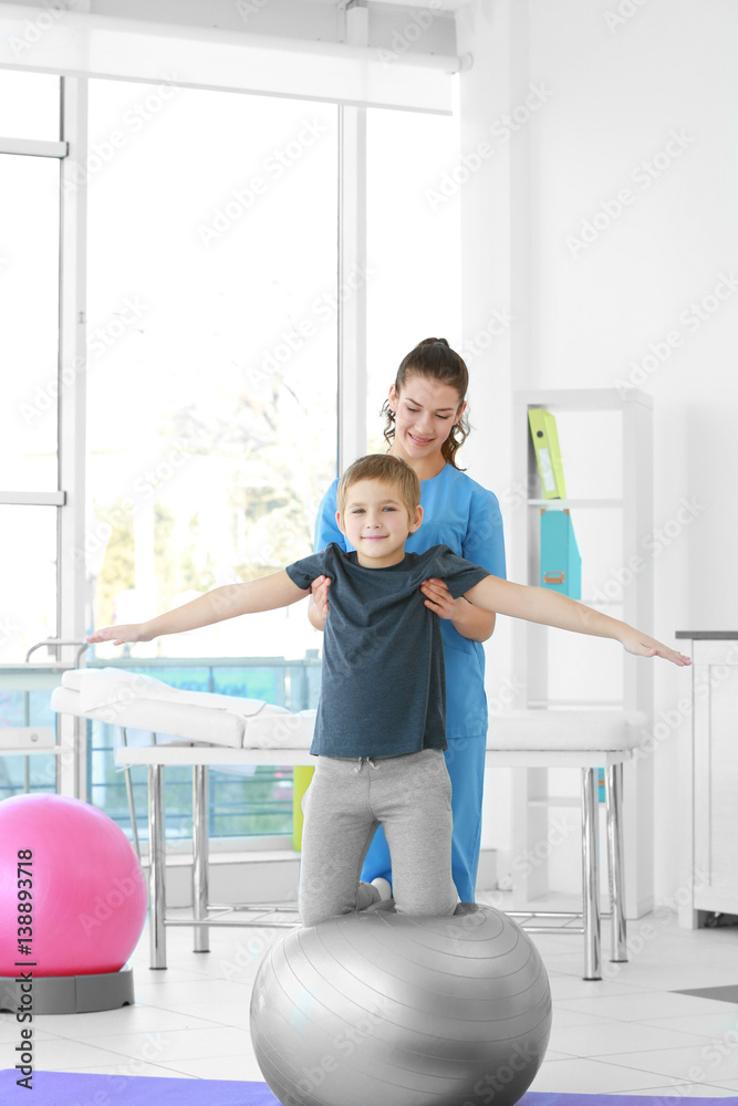 Physiotherapist working with patient in clinic Physiotherapist working with patient in clinic