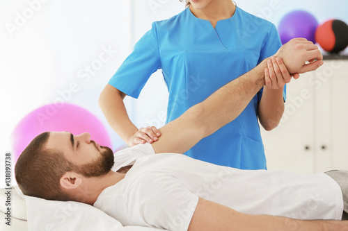 Physiotherapist working wit...