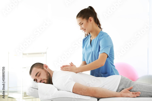 Physiotherapist working wit...