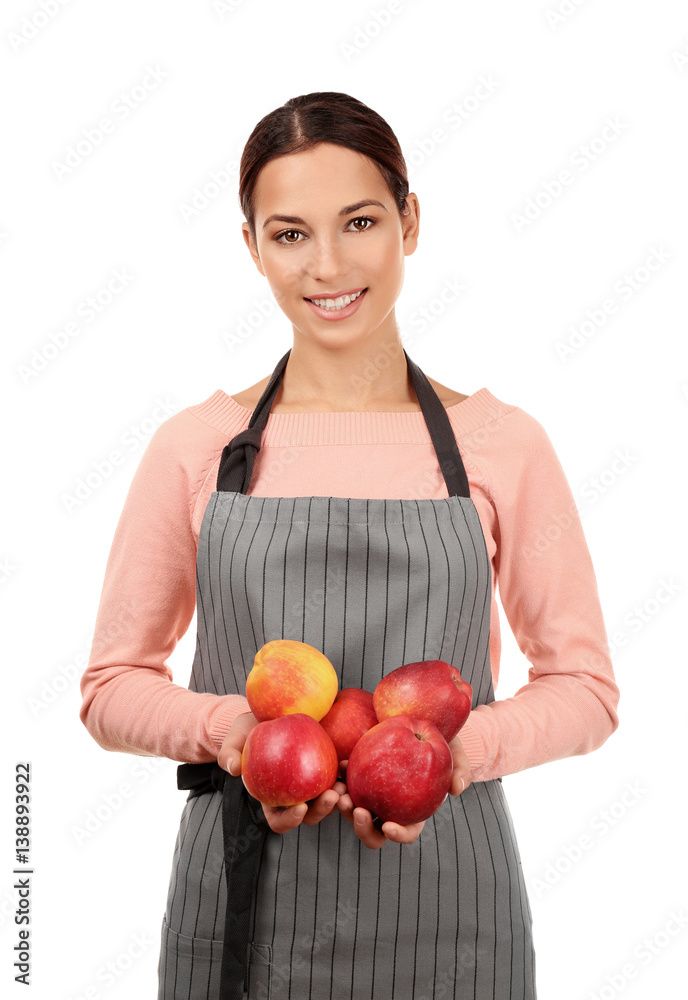 Young woman in apron holding juicy apples on white background Young woman in apron holding juicy apples on white background