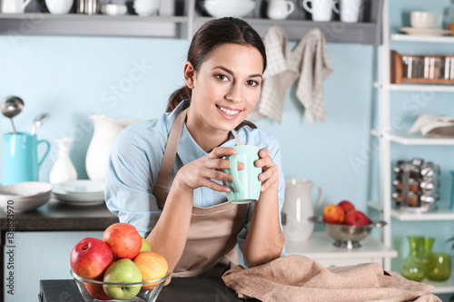 Young woman with cup of cof...