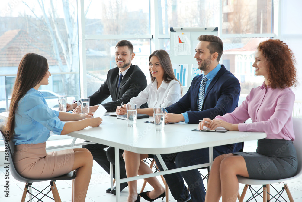 Job interview concept. Human resources commission interviewing woman