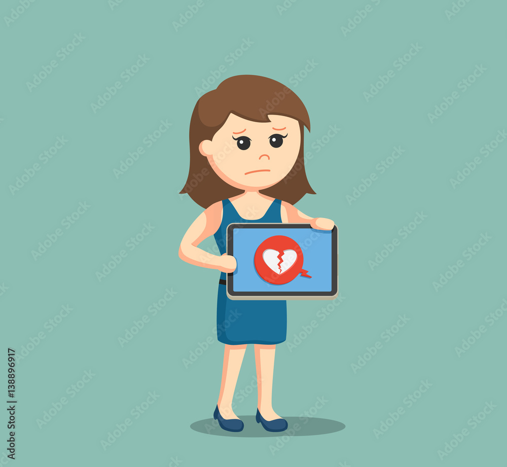 girl holding tablet with broken heart displayed