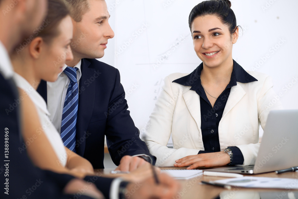 Group of business people and lawyers discussing contract papers at meeting Group of business people and lawyers discussing contract papers at meeting