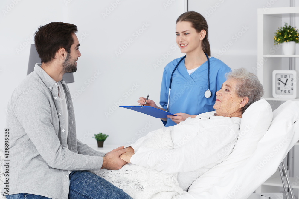 Grandmother, grandson and doctor at hospital Grandmother, grandson and doctor at hospital