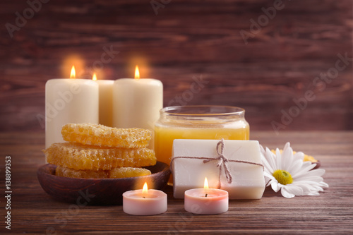 Beautiful composition of natural honey spa set on wooden background