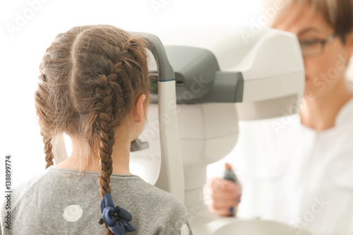 Ophthalmologist measuring i...