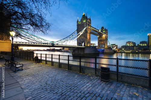Tower Bridge viewed from Tower of London side of the Thames river at night before the sunrise in London  England