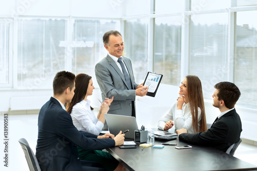 successful businessman and his business team meeting in a modern office