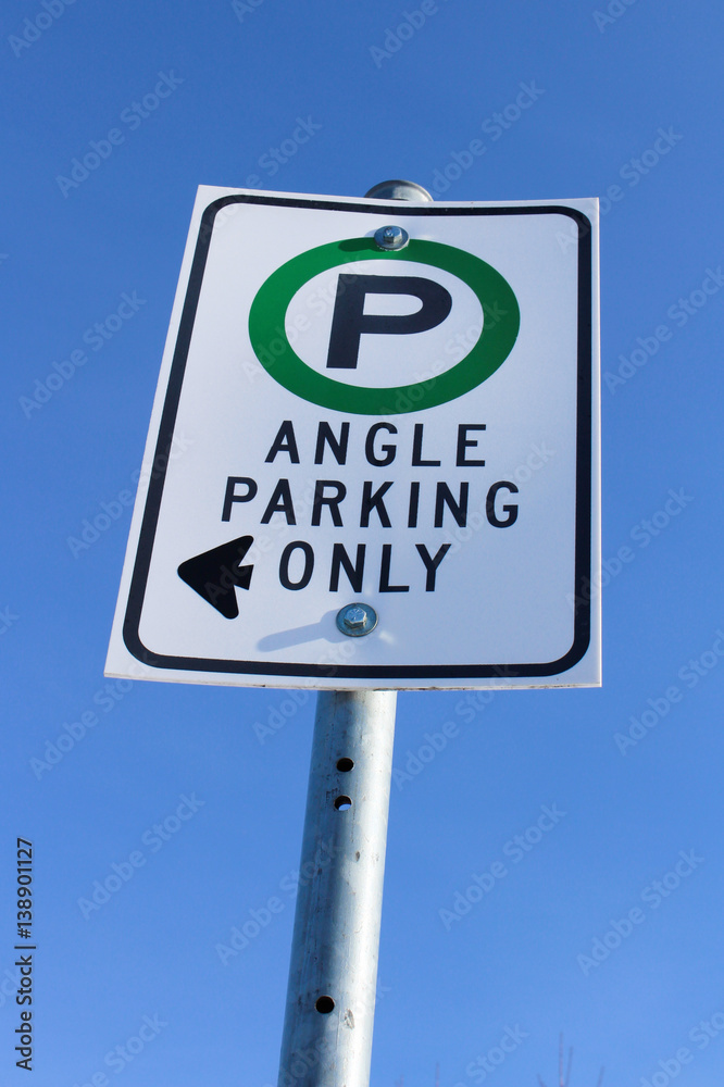Angle Parking Only Sign Against Blue Sky